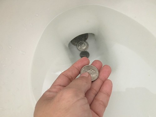 coins in the toilet bowl