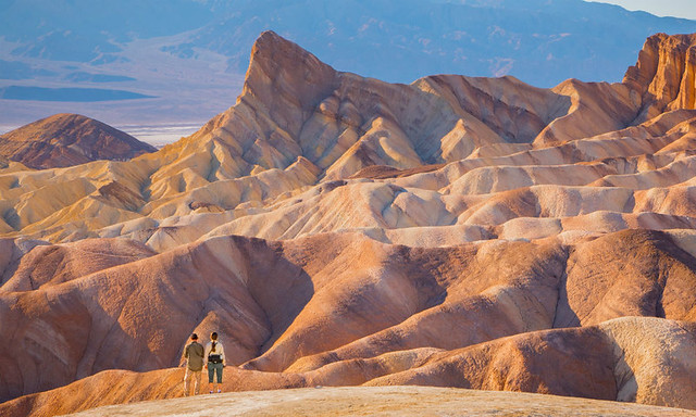 hikers-standing-in-front-of-beautiful-inspiring-landscape-death-valley-national-park