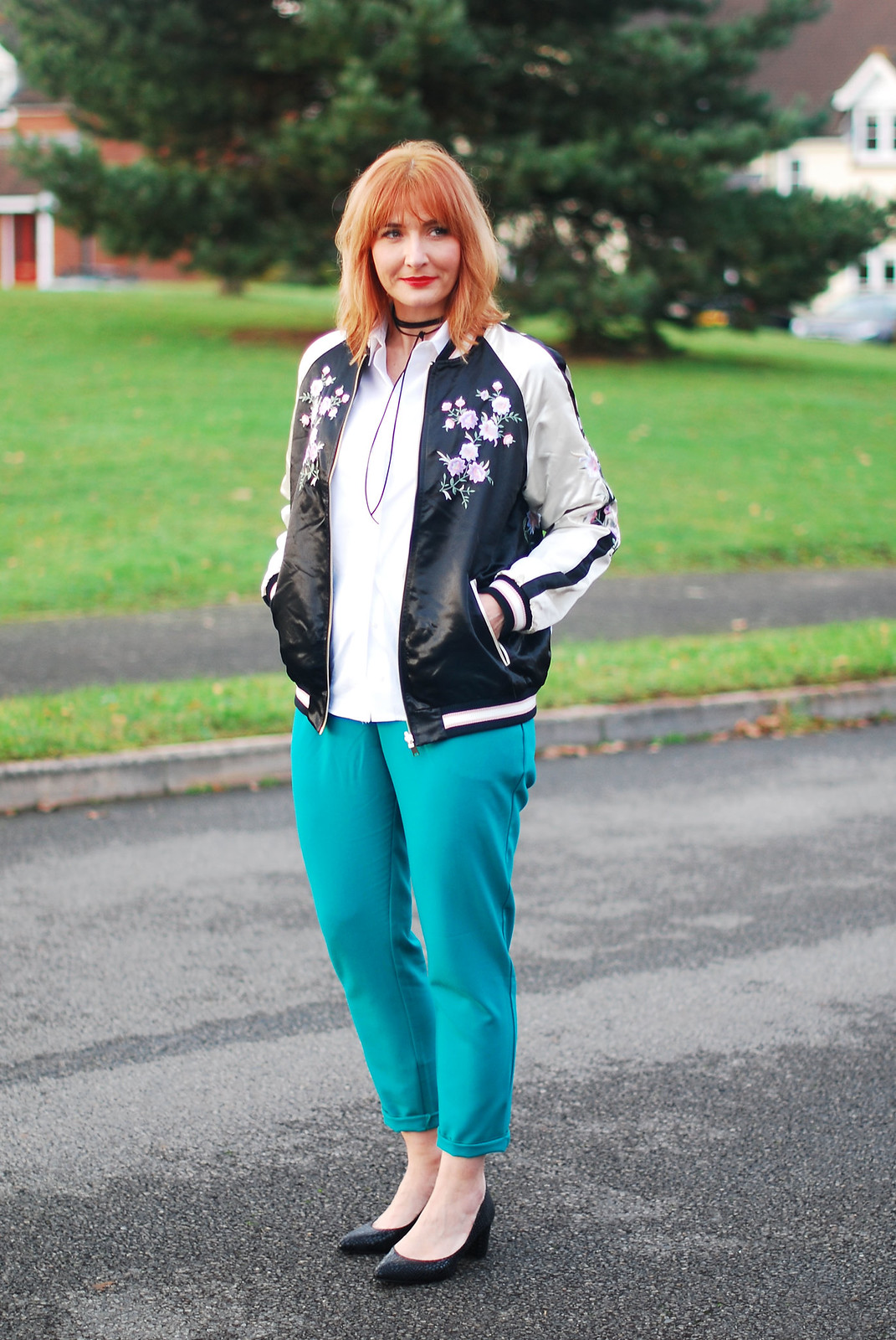 Smart casual weekend wear floral embroidered bomber jacket emerald green peg leg trousers black block heel shoes white shirt black tie-up choker necklace | Not Dressed As Lamb, over 40 style
