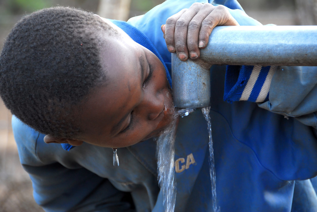 african child drinking water