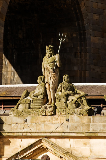 An image of a statue of Neptune above the old Fish Market.