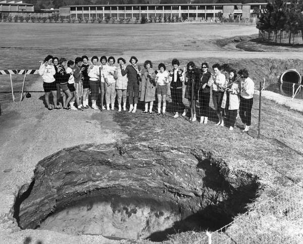 Students examining sinkhole - Tallahassee
