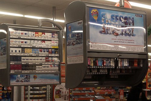 Cigarette displays above the cash registers in a Russian supermarket