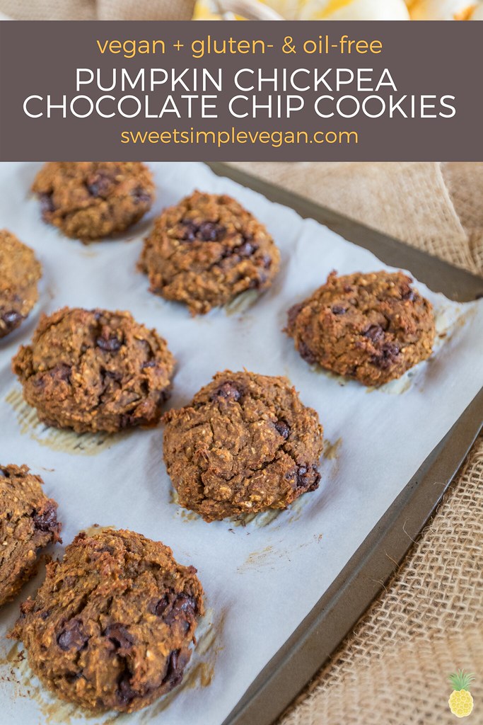 vegan Pumpkin Chickpea Chocolate Chip Cookies on a parchment lined baking sheet from sweetsimplevegan.cokm