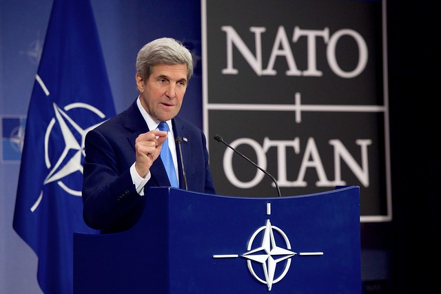 Secretary Kerry Addresses Reporters During a News Conference at NATO in Brussels