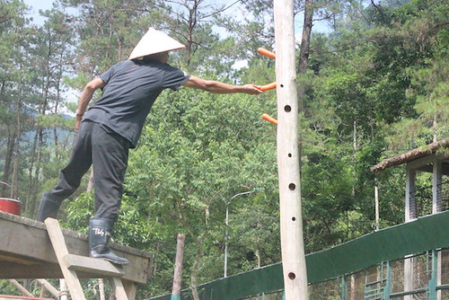 A bear worker is setting up enclosure for bears at VBRC, 2014