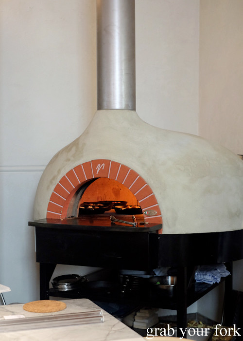 Wood-fired oven in the open kitchen at Fred's in Paddington