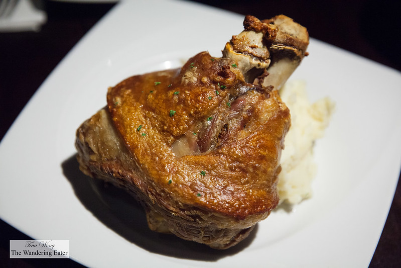 Haxen - Oven roasted german style pork knuckle served with sauerkraut, and creamy mashed potato