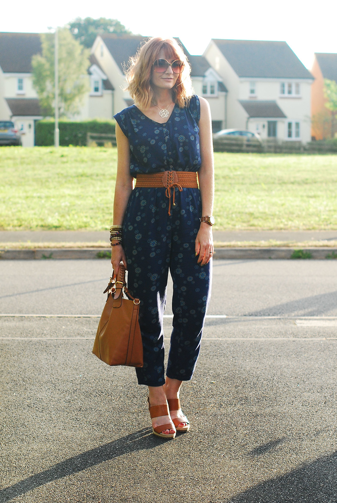 Simple summer styling: Blue floral jumpsuit with tan accessories | Not Dressed As Lamb