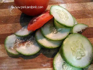Chop tomatoes and cucumbers into thin slices