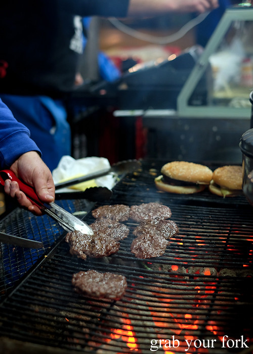 Camel burgers cooking over charcoal at the Ramadan food festival in Lakemba Sydney