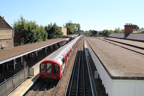 Westbound Central Line train 91107 waits at South Woodford Station