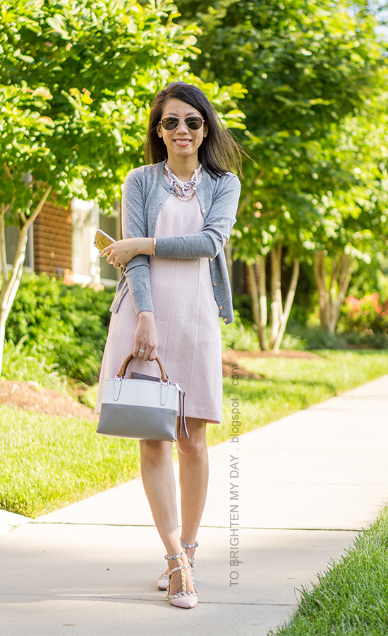 mixed pearl necklace, gray cardigan, pink wool shift dress, colorblocked bag, watercolor studded flats