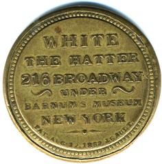 White the Hatter encased Postage stamp reverse