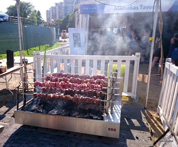  lamb roasting on skewers