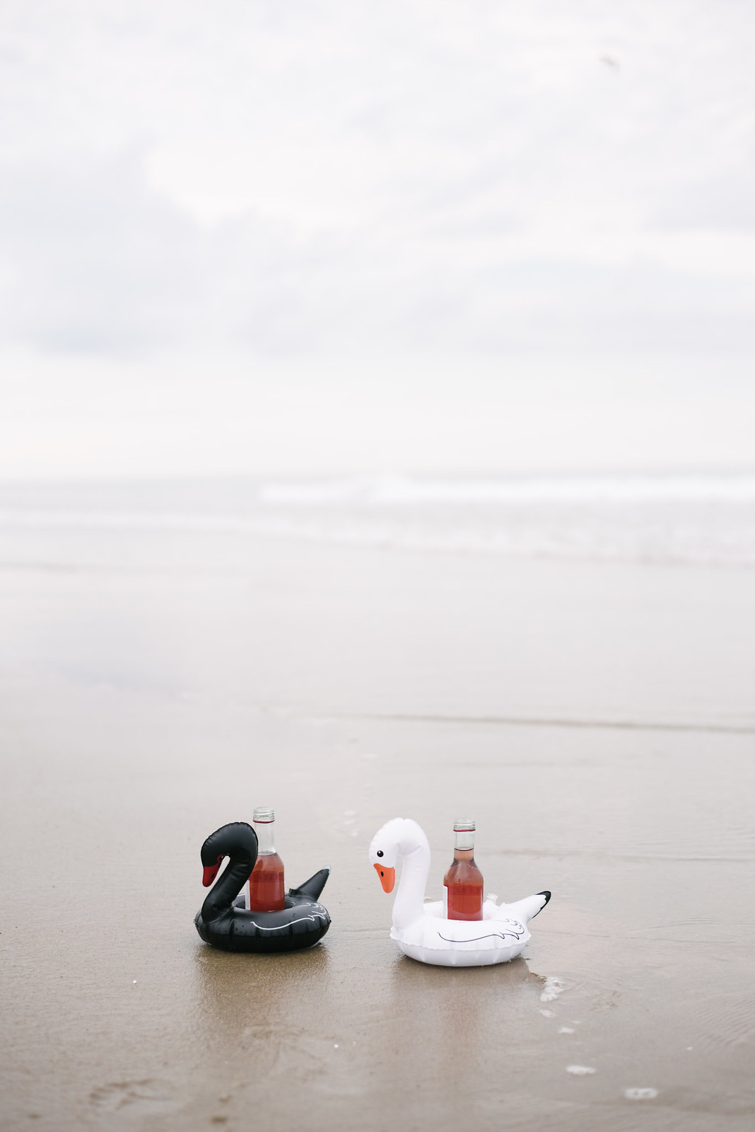 Mini Swan Floats with mini bottles of Rose on juliettelaura.blogspot.com