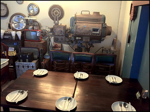 Table next to old movie projector