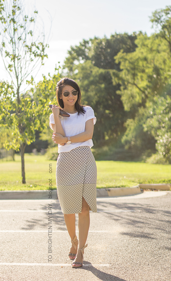 white tee, oversized watch, jacquard patterned wrap skirt, clutch, ankle tie jeweled sandals