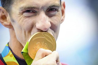 Michael Phelps with Olympic gold medal